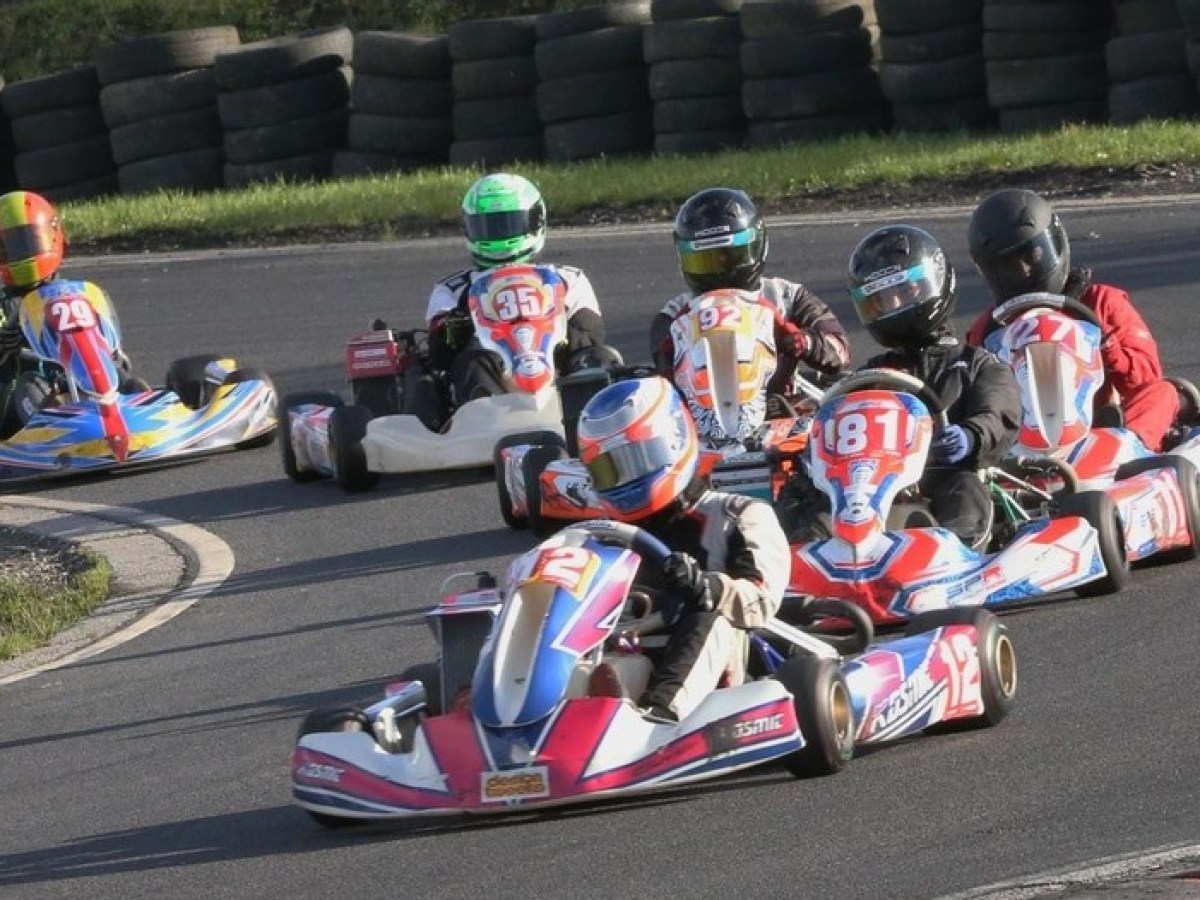 a group of people riding on the back of a motorcycle